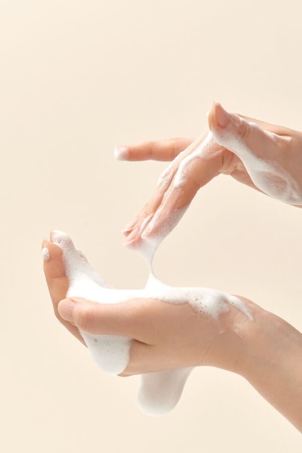 Rich cleansing foam texture between hands